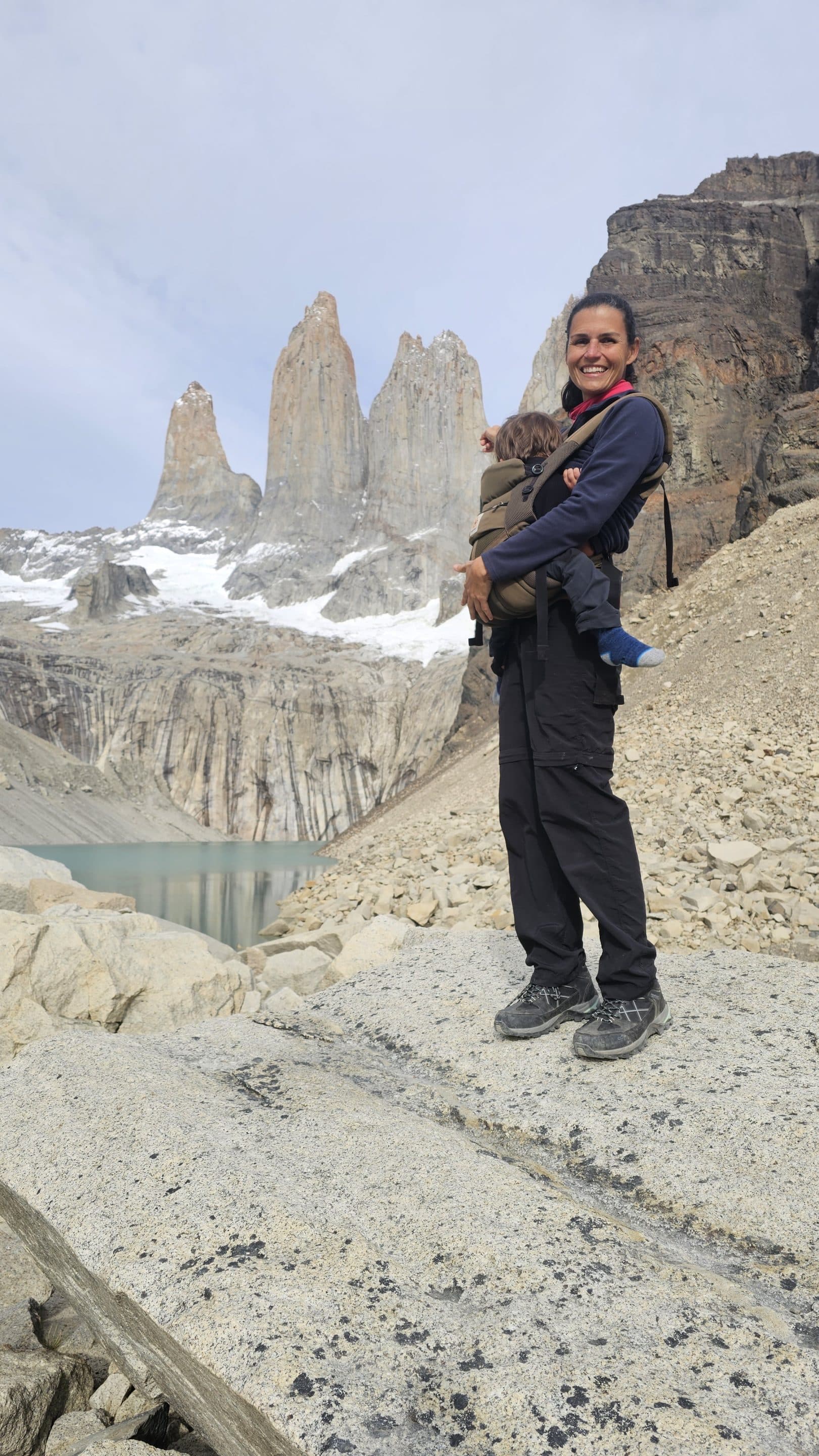 Stacey carrying Freddy in front of the Torres del Paine towers
